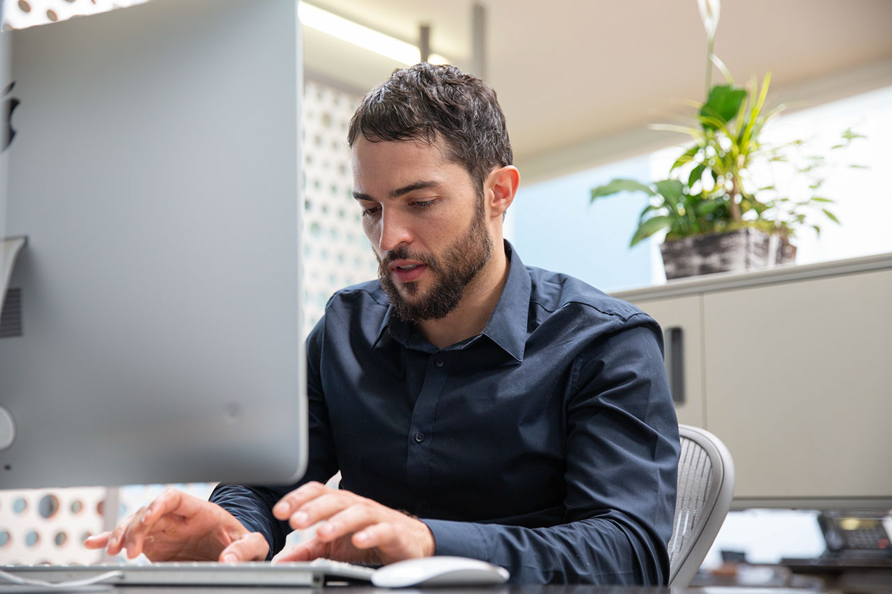 Man in office working on computer