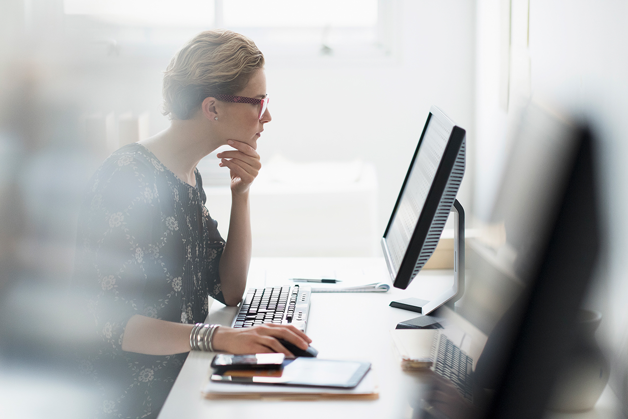 Business woman working on computer in office