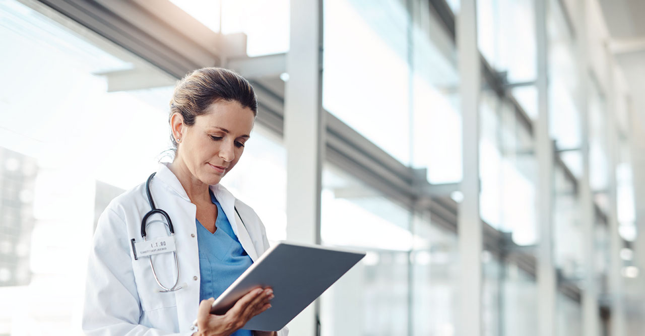 Doctor looking at tablet