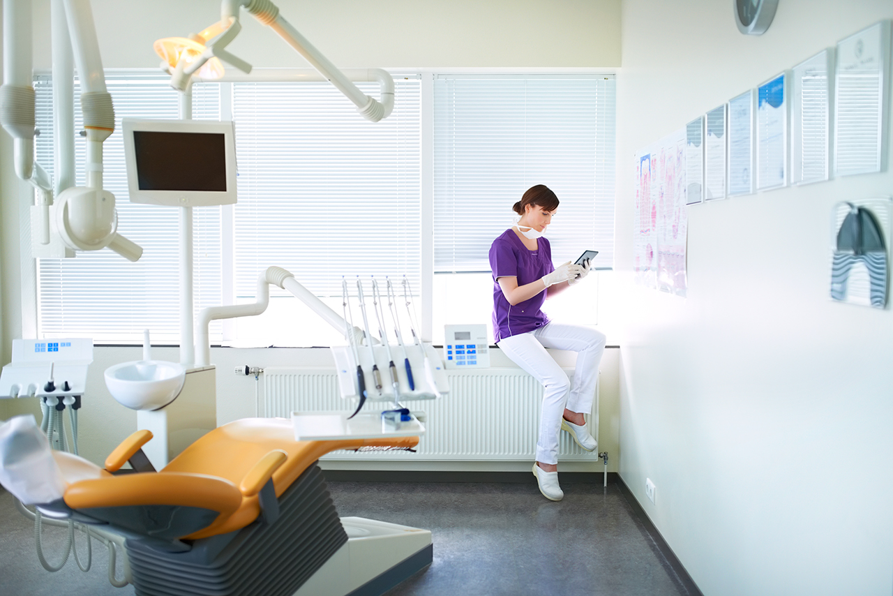 Dentist using a tablet