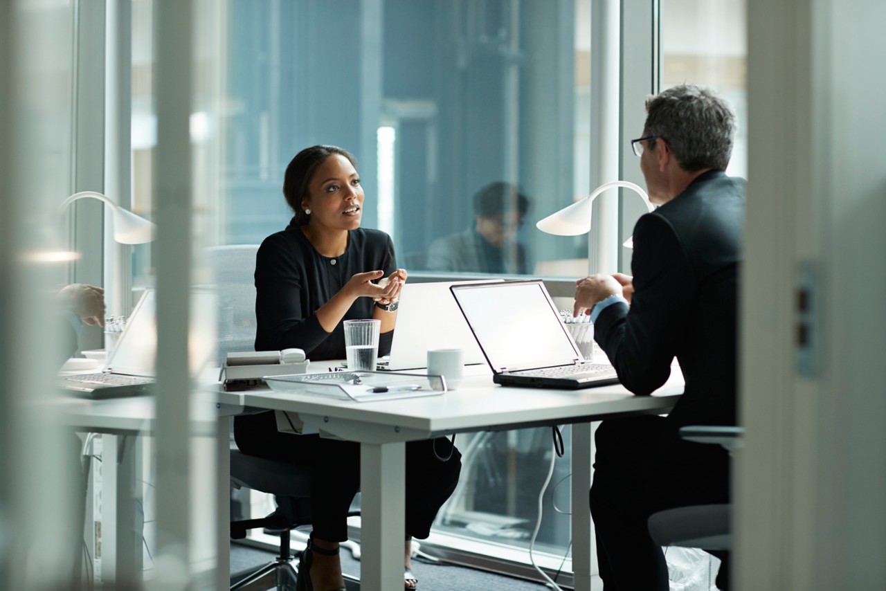 Business colleagues working in modern open office