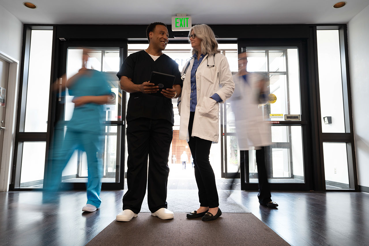 Doctors standing at hospital entrance