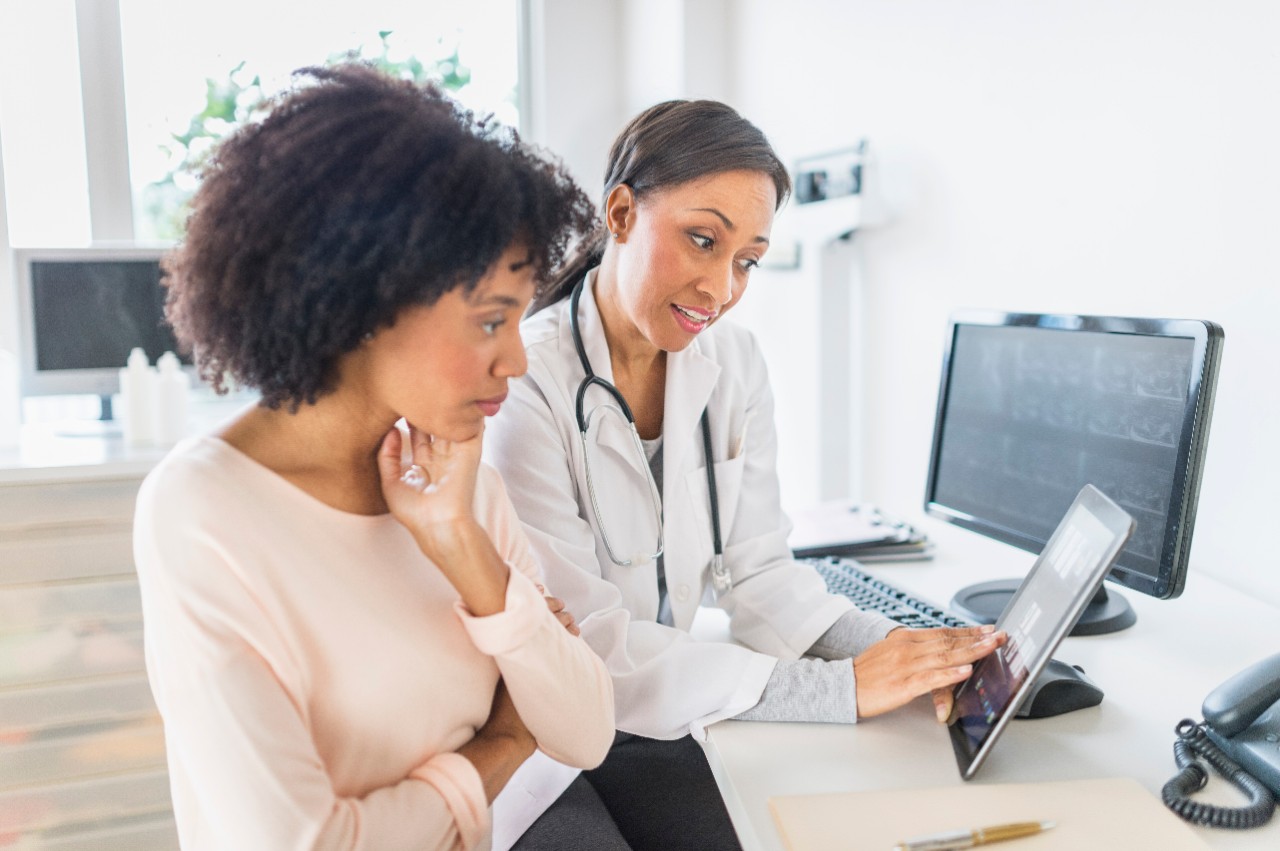 Provider and patient looking at results on tablet